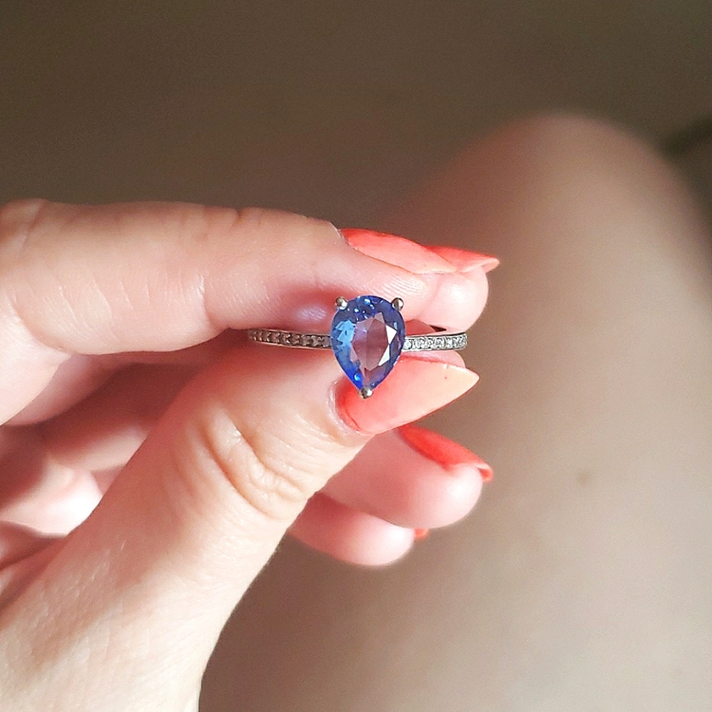 Ring with purple centre stone